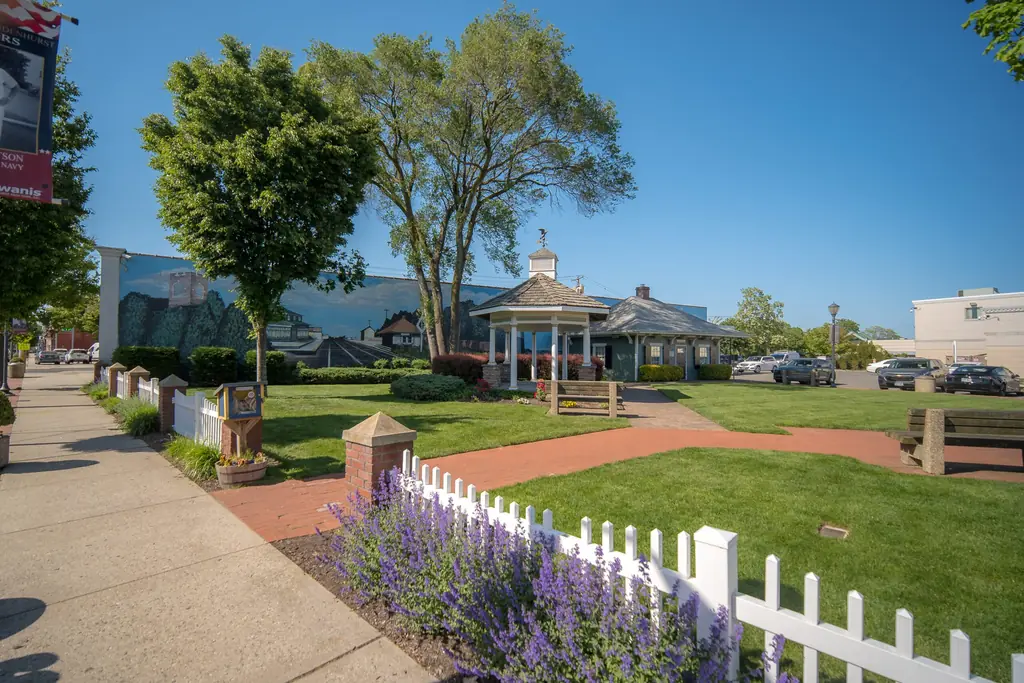 The Village Square gazebo with lavender and a white picket fence